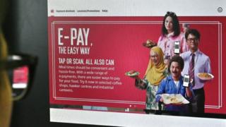 The Nets e-pay advert showing actor Dennis Chew in dark make up, dressed as both an Indian man and a Malaysian woman in a hijab