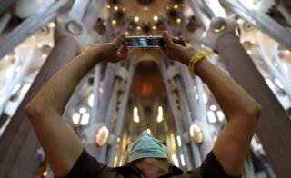 Health workers, police officers and NGO staff visit the Sagrada Familia basilica with their families as it reopens following the coronavirus disease outbreak, in Barcelona, Spain, 4 July 2020