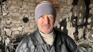 Oleksandr Rogovitz in his bombed out block of flats