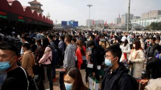 Crowd of people outside Beijing railway station