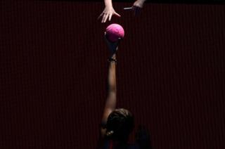 Russia's Anastasia Pavlyuchenkova holds up a large ball