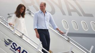 Duke and Duchess of Cambridge walk down the steps of a plane as they arrive in Lahore on 17 October 2019