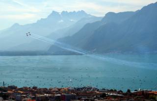 Fighter aircraft F-5 Tigers perform a show above Lake Leman in Vevey, Switzerland