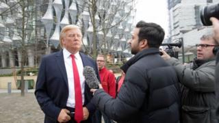 A wax figure of Mr Trump outside the new US Embassy in Nine Elms