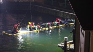 Officers search the marina