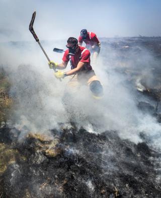 Fire chiefs declared a major incident on Saturday after two large-scale blazes either side of Winter Hill near Bolton merged because of increased wind speed. Tuesday July 3, 2018.