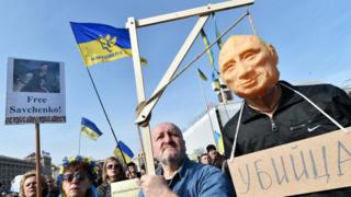 Protesters with an effigy of Vladimir Putin in Kiev, Ukraine