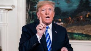 . Trump signs a National Security Presidential Memorandum as he announces the withdrawal of the United States from the Iran nuclear deal
