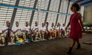 A model presents a creation as inmates crochet clothing as part of "Ponto Firme" project in the Adriano Marrey maximum security penitentiary in Guarulhos, Brazil on May 22, 2019