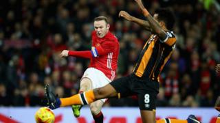 Les joueurs Wayne Rooney et Tom Huddlestone