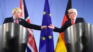 Boris Johnson offers Frank-Walter Steinmeier a fist bump during a joint news conference in Berlin on 4 November.