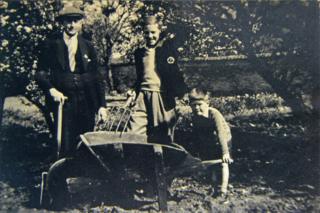 Jim Wilson with his father and brother in a garden