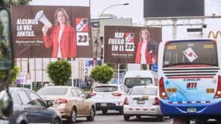 A general view of traffic at a street with electoral posters of Maricarmen Alva, a candidate for Congress from the Popular Action party, in Lima, 22 January 2020