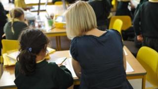 Teacher with pupil