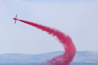 Red Arrow flying in the sky