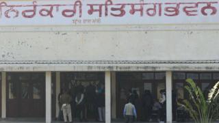 NIA) officials inspect the scene at Nirankari Satsang Bhawan in Rajasansi village on the outskirts of Amritsar on November 19, 2018