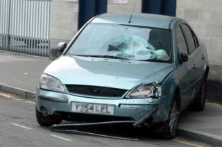 The Ford Mondeo involved in the crash, showing damage to the windscreen and passenger side headlight
