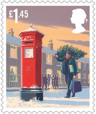 Christmas scene stamp featuring a man carrying a Christmas tree and presents past a post box