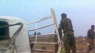 Soldiers examine the bodies of several people on the back of a truck that was involved in a deadly traffic accident near Swaziland's capital Mbabane - 29 August 2015