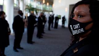 Attendees line up in preparation for the casket of George Floyd