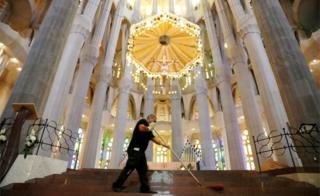 A man cleans the Sagrada Familia basilica ahead of its reopening, after being closed for over three months due to the coronavirus outbreak, Spain 3 July 2020