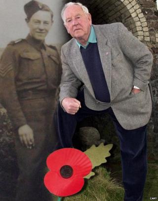 Trevor Miners with a photo of himself taken in the 1940s