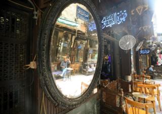 Al-Fishawy cafe in Cairo, Egypt, 27 June 2020. Egyptian authorities decided to ease coronavirus restrictions gradually. Cafes and restaurants are back to business starting from 27 June 2020, but they must operate at 25% of their capacity and observe social distancing among other safety measures, and any violations will result in the suspension of the facility"s activities.