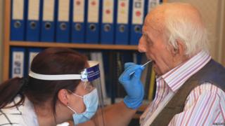 A care home resident is tested for coronavirus