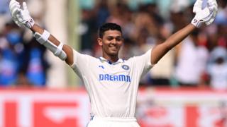 India opener Yashasvi Jaiswal raises his arms in celebration after making a century