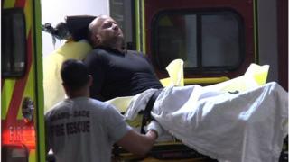 Gunman on a stretcher