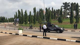 Members of the security forces secure the area outside the National Assembly in Abuja