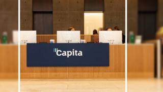 People working at the reception of Capita's offices