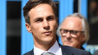 Danish golfer Thorbjorn Olesen (L) departs Uxbridge Magistrates Court in west London