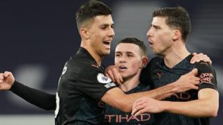 Manchester City's players celebrate a goal against Everton in the Premier League