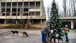 Residents decorating Christmas tree