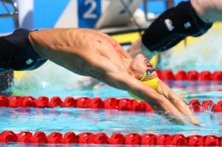 Mitch Larkin of Australia competes during the men's 100m backstroke heat 3