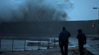 A huge wave breaks on the Cobb in Lyme Regis