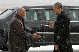 environment John Conyers (D-MI) (L) greets President Barack Obama as he arrives aboard Air Force One at Detroit Metropolitan Wayne County Airport in Detroit, Michigan January 20, 2016.