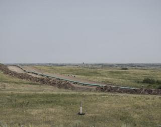 The pipeline runs along the ground