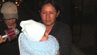 Maribel Musaja carrying Mateo in Arequipa, Peru