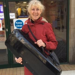 Fiona West with her viola and case