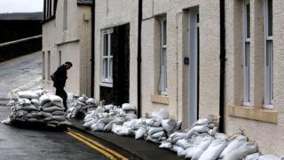 Man prepares for more flooding with sandbags in Scotland