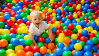 Child in ball pool