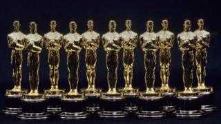 A view of 11 Oscars statues lined up next to each other in 1990 in Los Angeles, California.