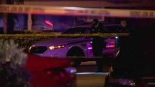 A police car and two officers in Fort Myers, Florida - 25 July 2016
