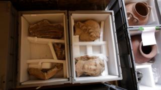 Plastic boxes containing artworks are placed for safe-keeping in an exhibition hall at the Musee de Louvre