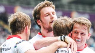 Craig Gilroy, Iain Henderson and Sean Reidy congratuate Andrew Trimble after his try