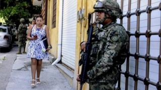 Marines stand guard in a street in Acapulco