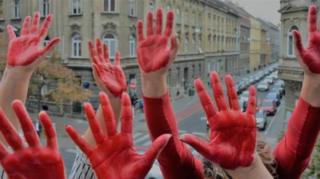 Hands painted in red