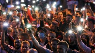 Belarus opposition activists light up their mobile phones during a peaceful protest rally against the results of the presidential elections, in Minsk, Belarus, 25 August 2020.